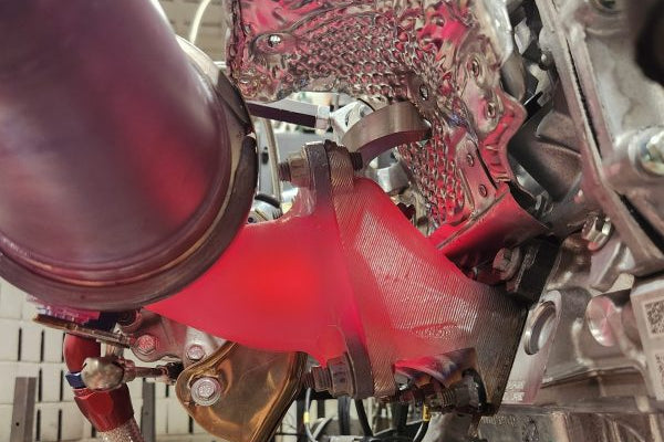Producing a temperature resistant racing car part